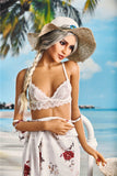 5ft 5in white skin athletic sex doll Kaja, pulling her summer dress down to her waist, wearing a white lace bra on the beach.