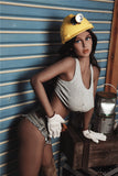Exotic, huge-breasted Amara, leaning on a wooden crate at her construction site, wearing cut off jean shorts, mini tank top, and construction helmet.